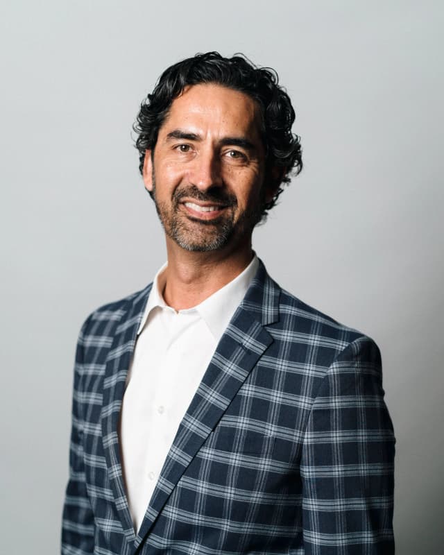 Executive portrait photography showing confident professional demeanor