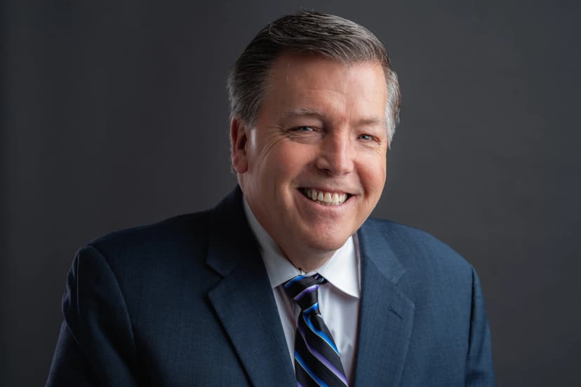 Modern professional headshot with clean lighting and natural expression