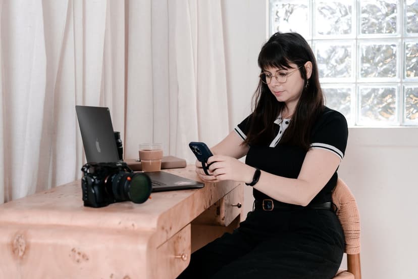 Marmalade Media founder Kayla Griffith reviewing a shot list beside a cinema camera during a production day